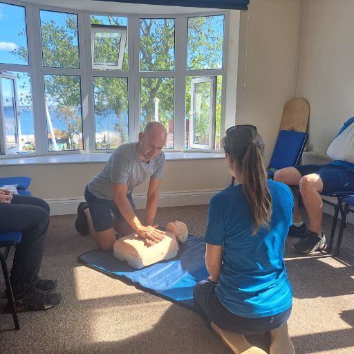 Participants learning first aid in a classroom