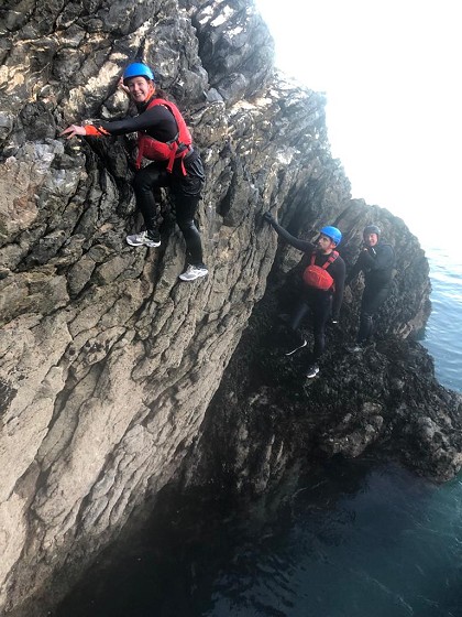 Group on the rocks above water